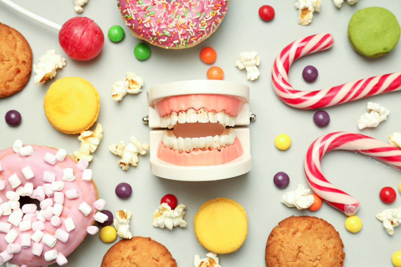 concept of food bad for teeth on light gray background