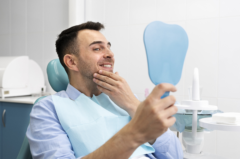 close up on happy client in dental clinic