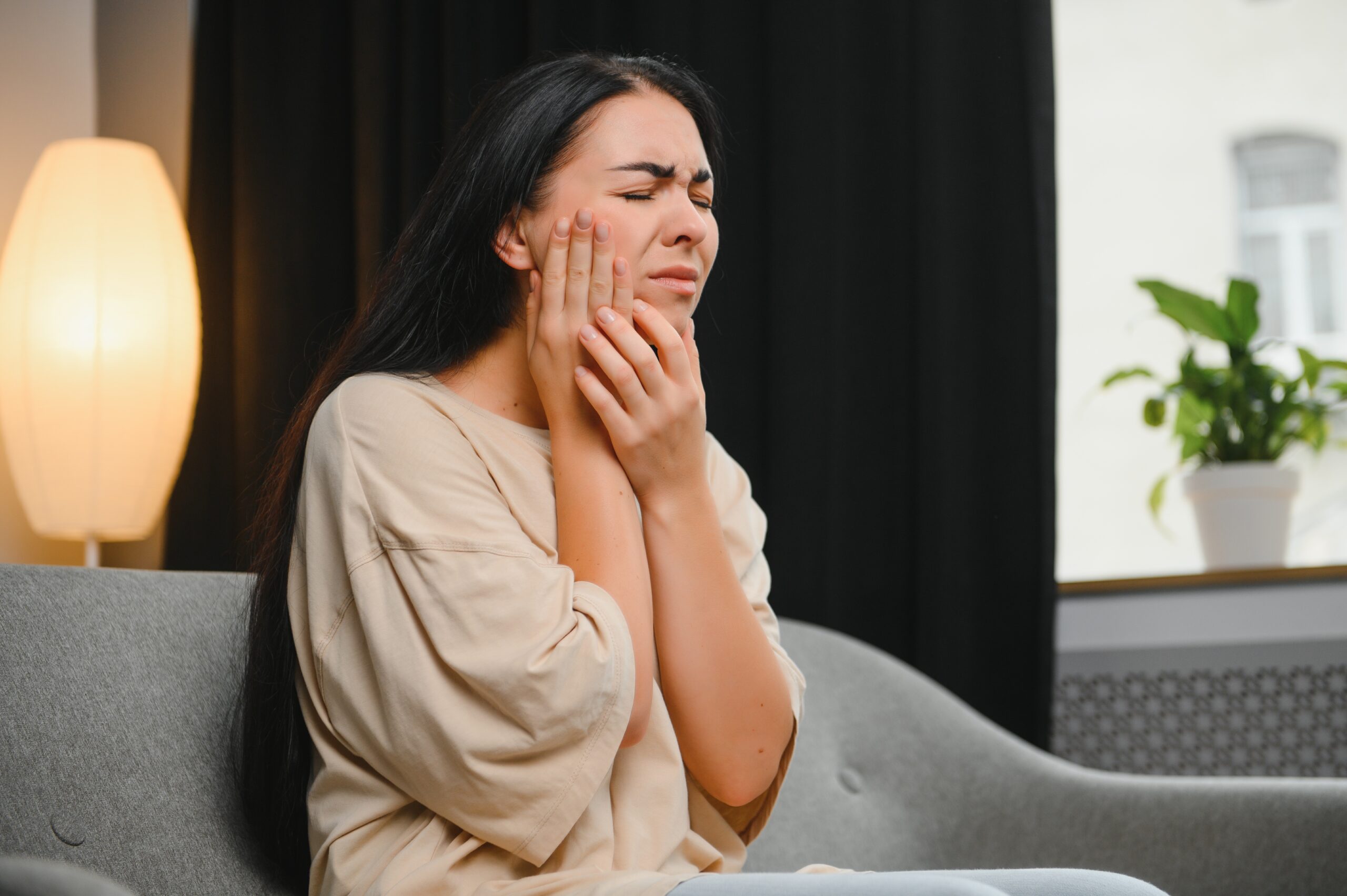 attractive young woman suffering from toothache w 2023 12 12 16 15 48 utc